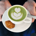 organic matcha latte in white cup with cookie