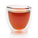 steeped honey chai black tea in glass cup