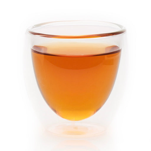 steeped Just Peachy black tea in glass cup